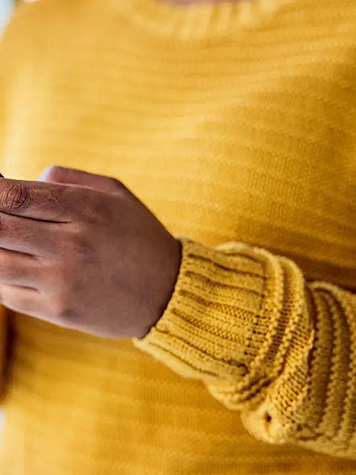 Close up photo of a person holding a cell phone in both hands