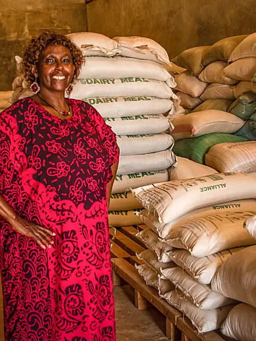 Lady with grain bags (credit Katie G. Nelson)