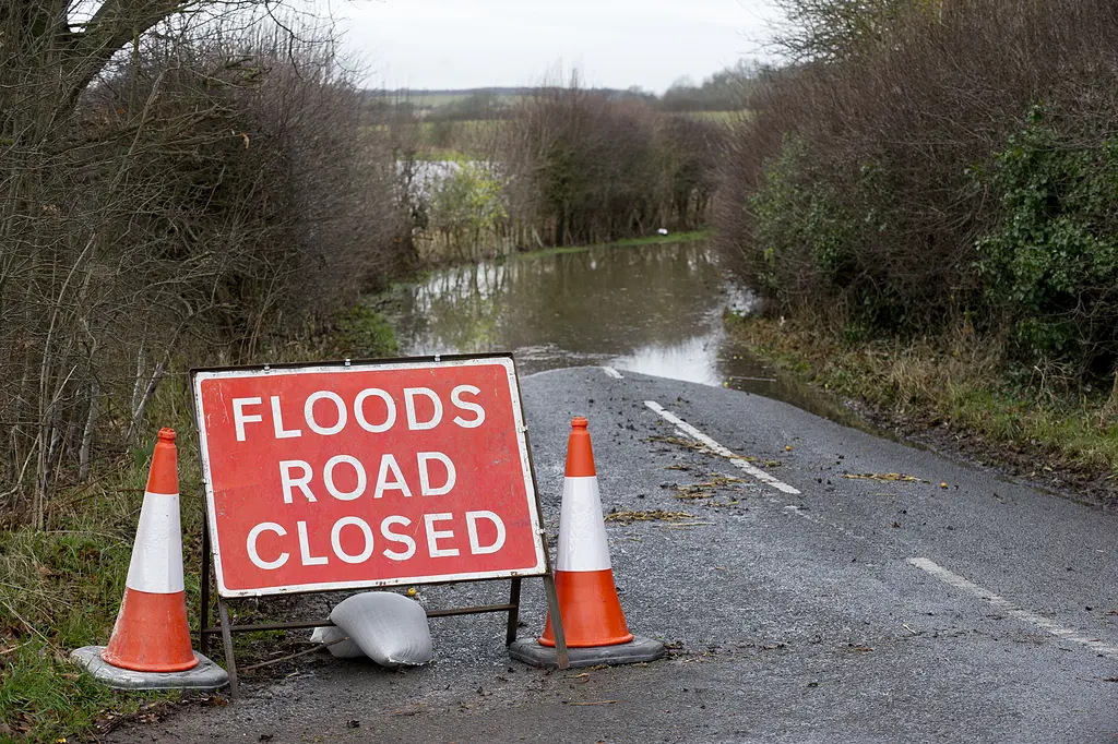 Flooded road with road closed sign