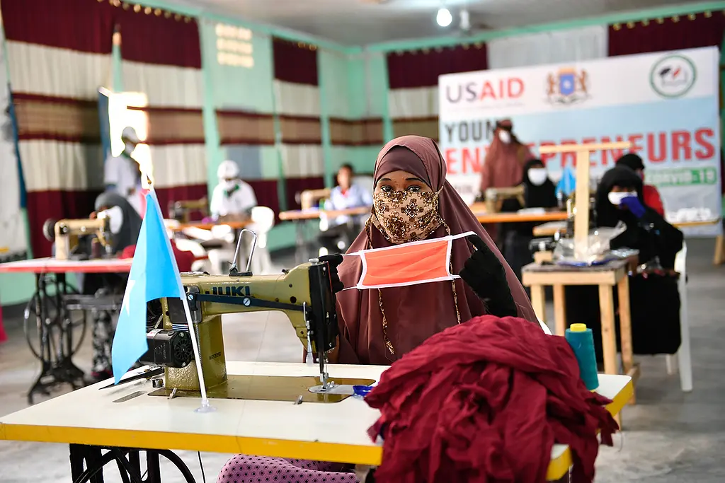 Youth in Somalia work to create non-medical grade protective face coverings and gloves to help slow the spread of COVID-19.