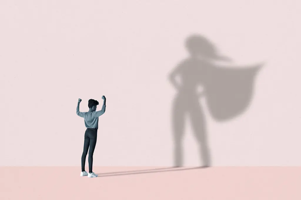 Image of a Black woman in a powerful pose, with her shadow appearing as a superhero