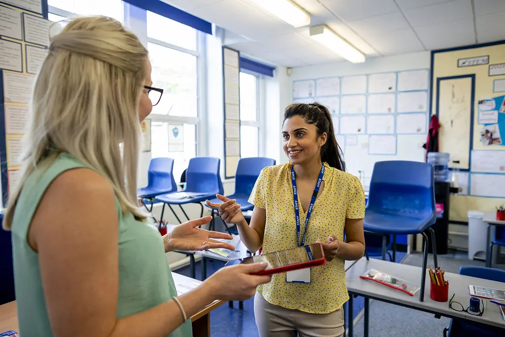 Two female teachers plan together