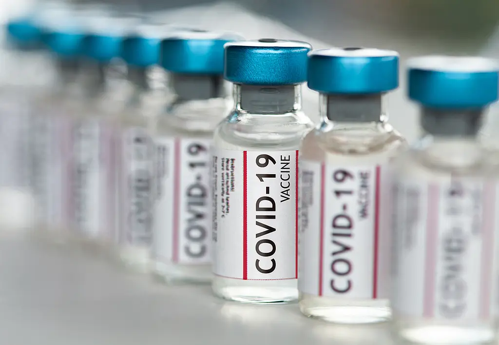 Closeup of vials of COVID-19 vaccines.