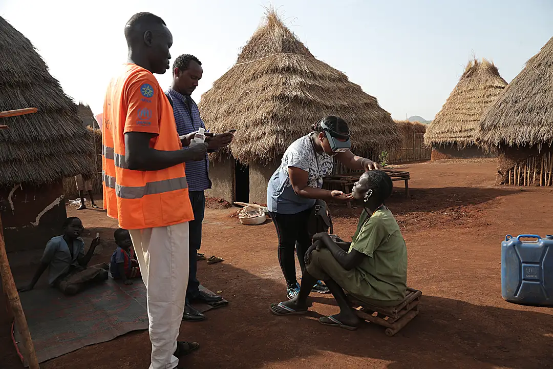 Peter, a trusted health worker and refugee himself, leads teams house to house during a survey for trachoma in Tsore refugee camp in Ethiopia. 