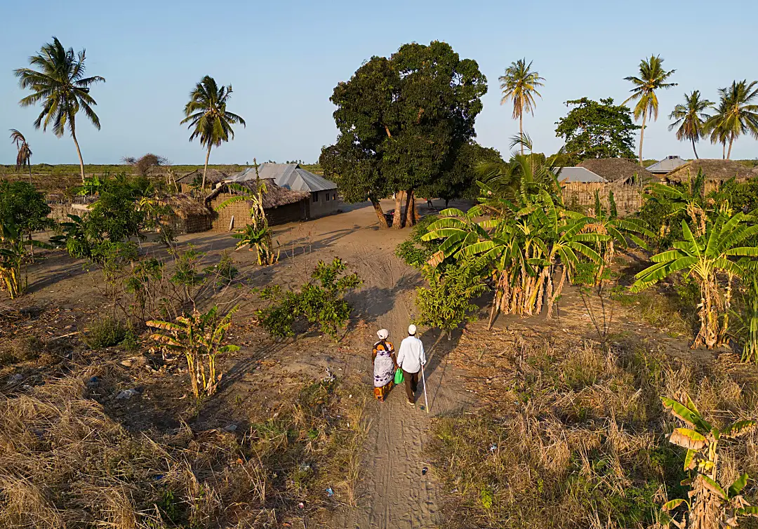 Community drug distributors travel miles to visit families in their homes in remote areas of Tanzania as part of a nationwide effort to eliminate LF