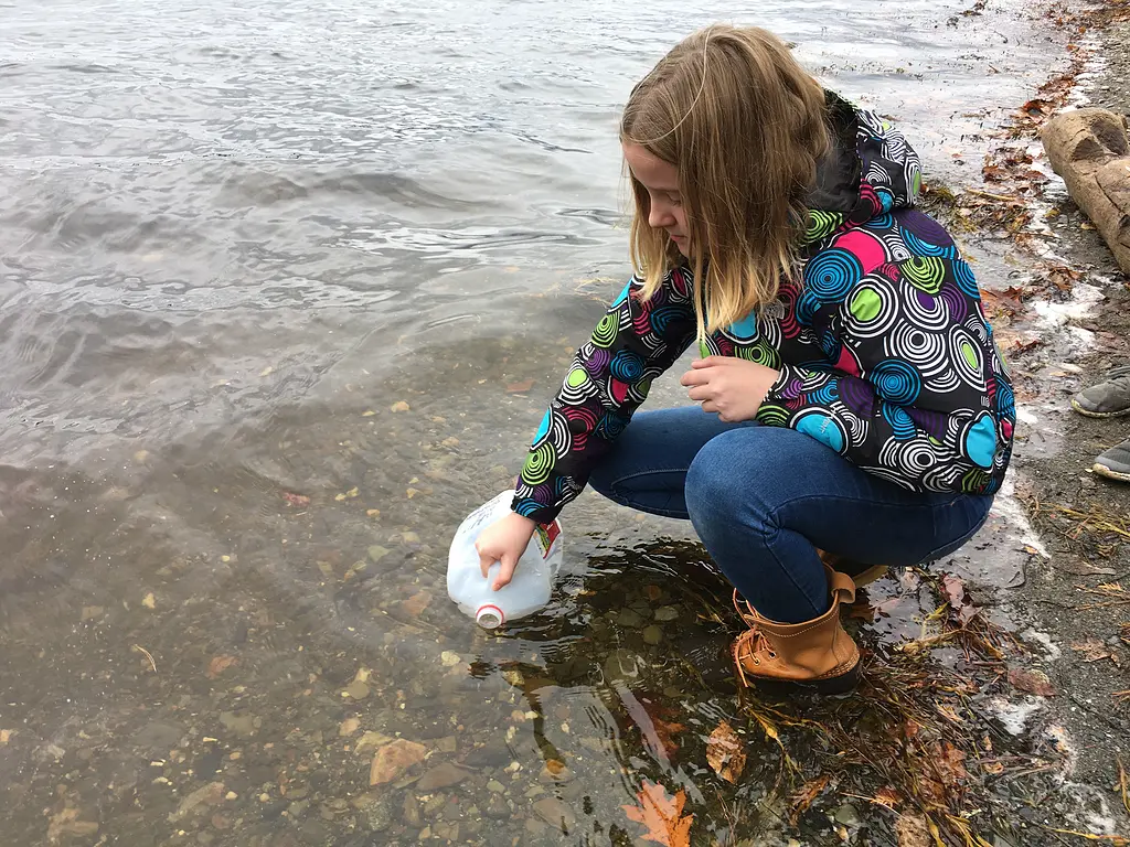 Edna Drinkwater School student collecting seawater for microplastic study