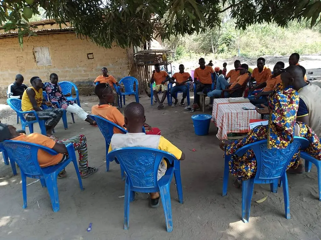 A community health meeting in Guinea, site of the Stop Palu + project.