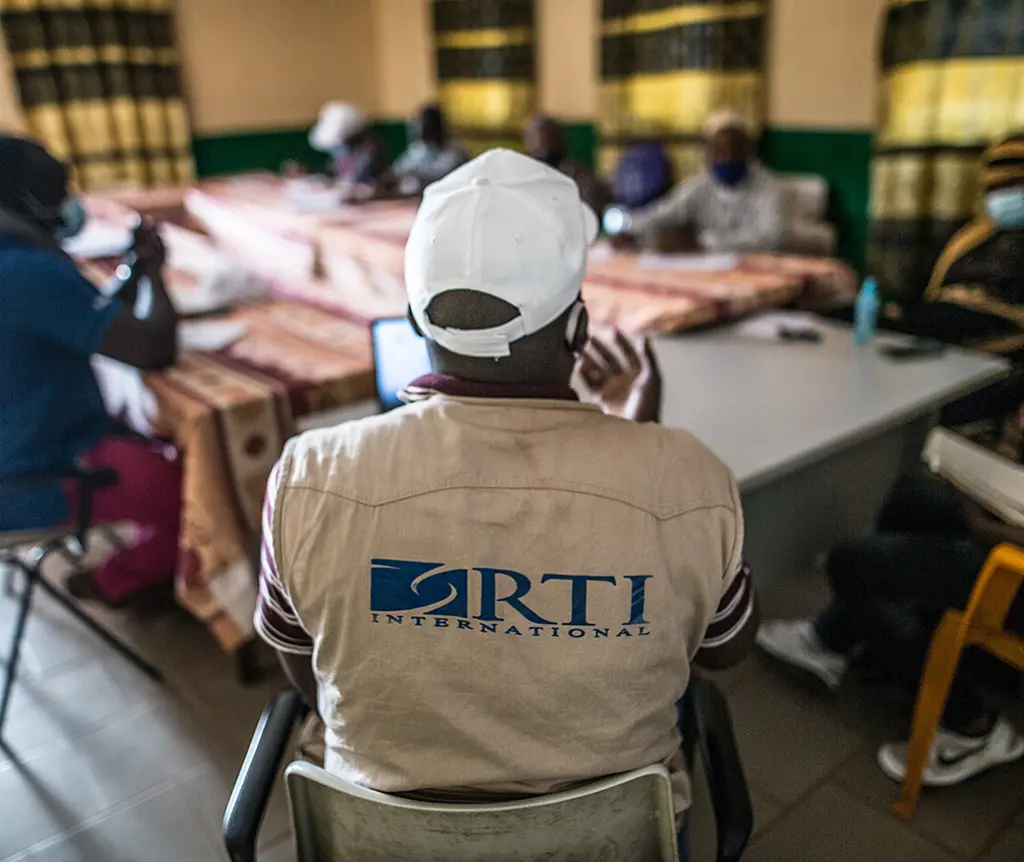 RTI staff meets with local health leaders in Labé, Guinea.