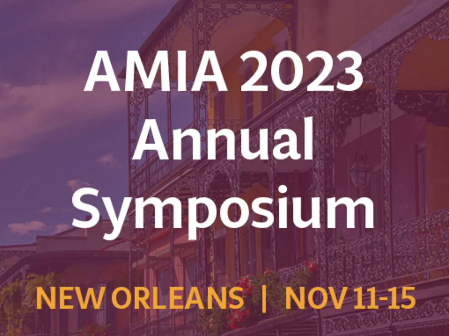 AMIA 2023 Annual Symposium, New Orleans, Nov 11-15; ornate building with ironwork balconies.