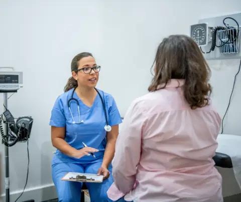 Doctor consults patient