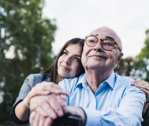 Elderly person and daughter