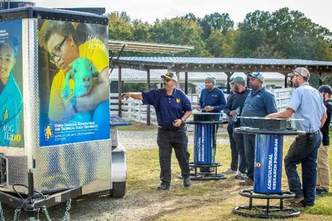 NC A&T’s Gregory Goines giving a presentation to farmers on solar-powered charging trailers