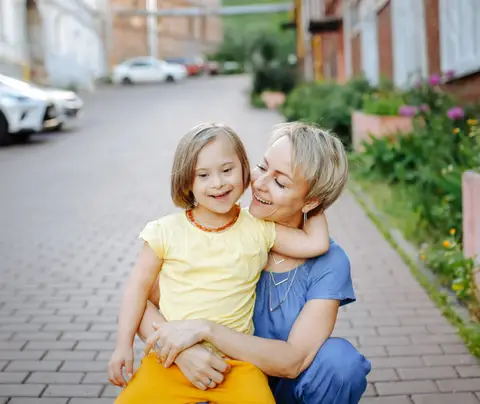 Mother embraces daughter