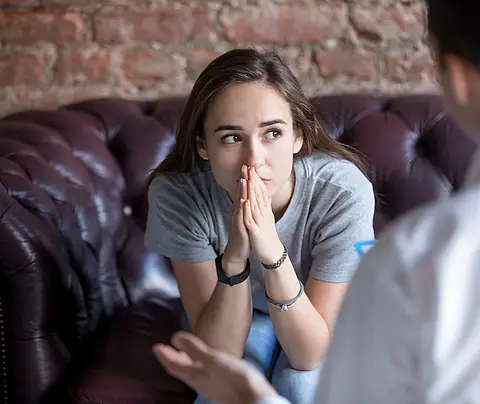 Young woman receiving counseling