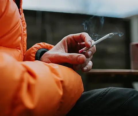 Woman holding a cigarette