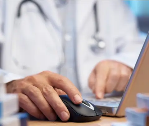 doctor searching Prescription Drug Monitoring Program