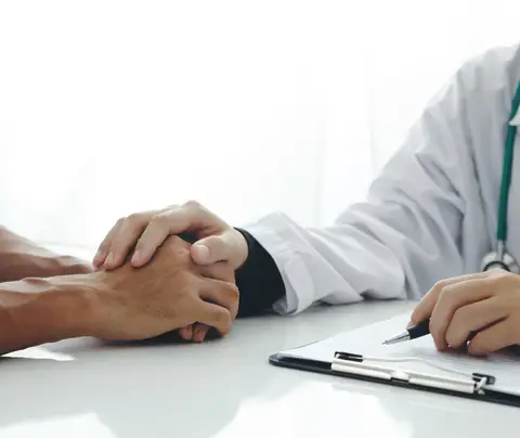 Doctor comforts patient