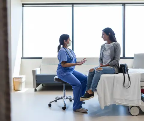 Doctor talks to patient