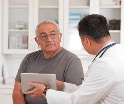 Doctor consults with patient