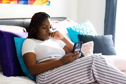 young Black woman on her phone