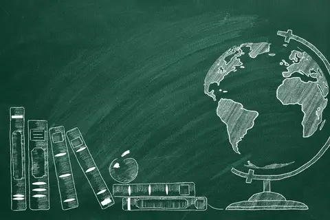 Chalk-drawn globe and books with an apple on a green chalkboard background, suggesting a classroom.