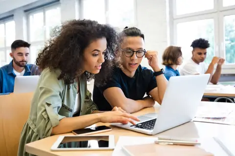 College students learning on laptop