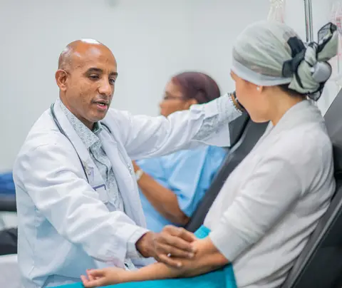 Oncologist speaks to patient