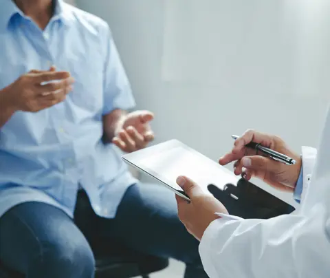 Doctor consults with patient