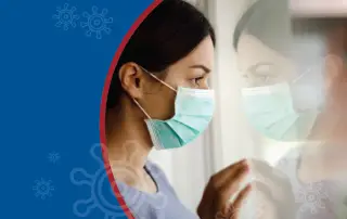 A woman wearing a mask gazes out a window, reflecting concern in a health-related context.