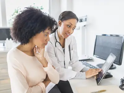 doctor and patient reviewing charts