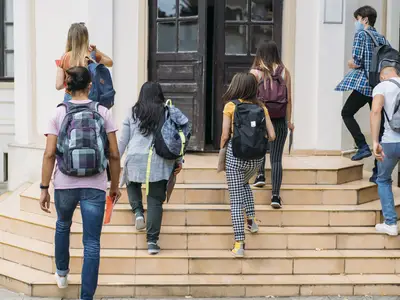 Group of students walking into school