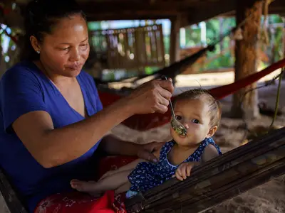 Woman feeding her baby