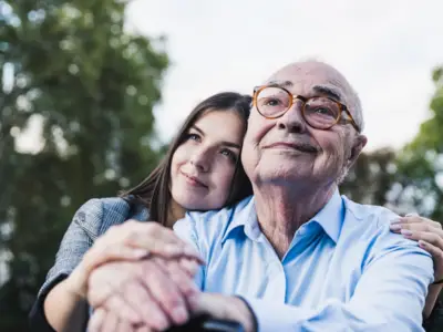 Elderly person and daughter