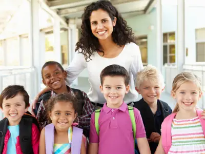 Female educator with group of elementary students