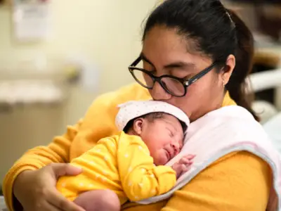 Mother nurses infant