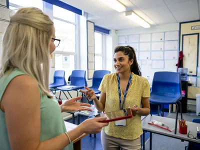 Two female teachers plan together