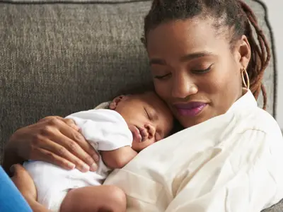 mother holding her baby 