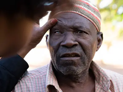 A man has his eyes examined for trachoma in Mozambique.