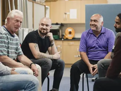 Group of men in support session