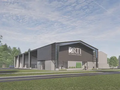 Graphic of new RTI Pilot Xcelerator. Building with offices and open garage space