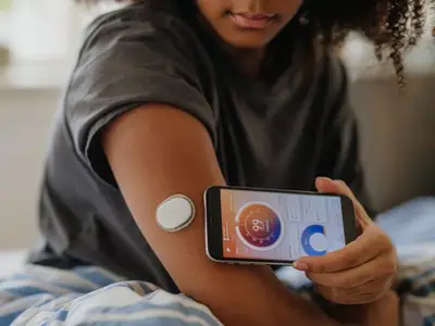 Young woman measures her blood sugar