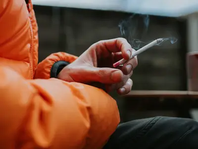 Woman holding a cigarette