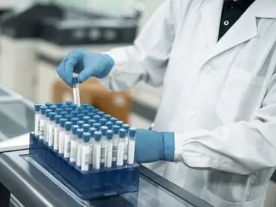 Laboratory technician interacts with samples