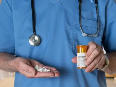 Doctor holding pills