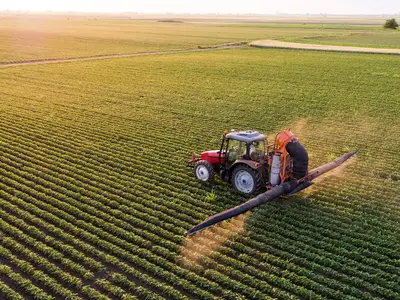 tractor spraying a field