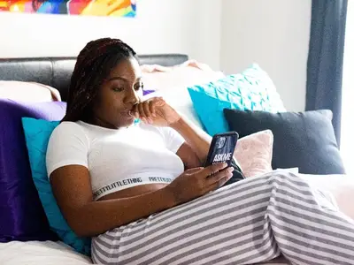 young Black woman on her phone