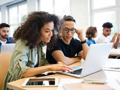 College students learning on laptop