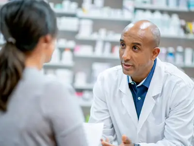 Pharmacist speaks to patient