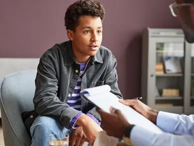 Young person consults with doctor