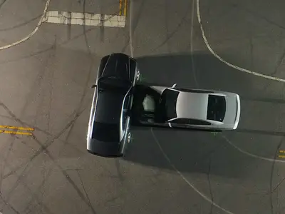 This aerial photo shows a simulated car collision scene as seen from a drone.